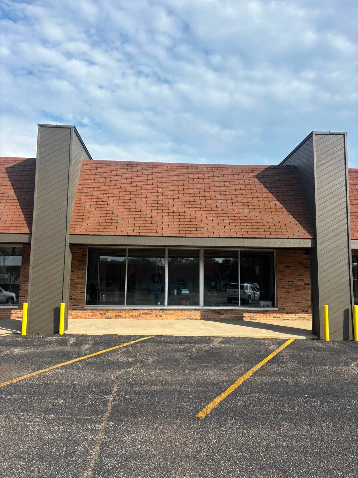 Clean shingles seen from the parking lot after a soft wash