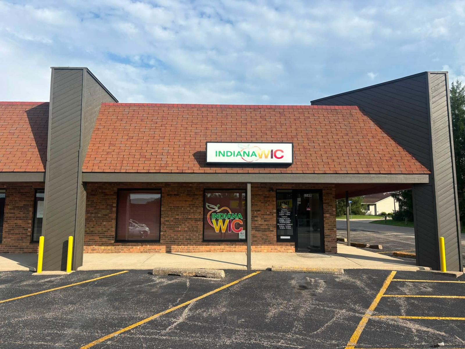 The same storefront entrance with a clean bright roof after soft washing